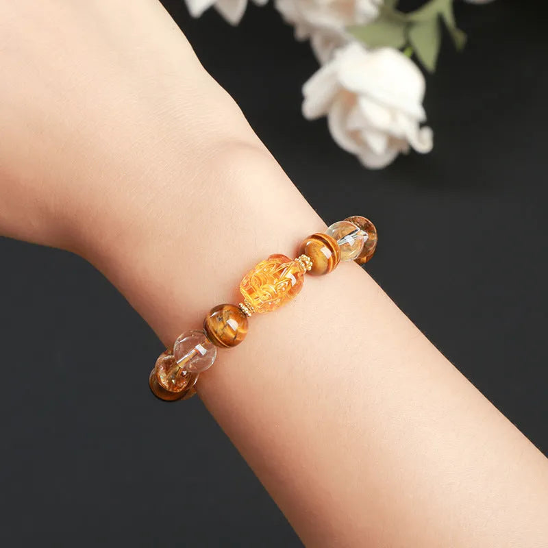 Yellow Tiger's Eye and citrine Pi Xiu bracelet with 10mm round geometric beads and steel details