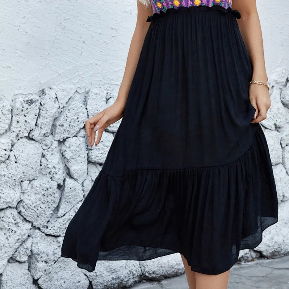 Purple sleeveless dress with hand-hooked floral embroidery on the front.