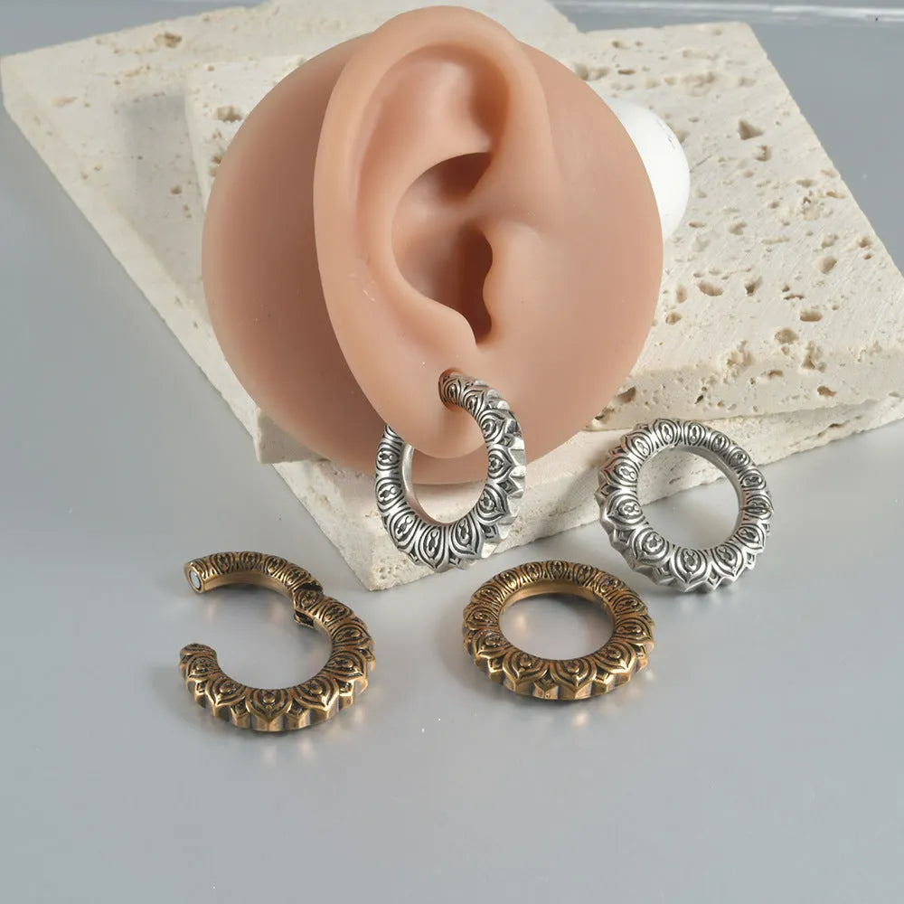 Large geometric dragon-shaped hollow out earrings in antique silver finish.