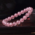 Women's strawberry quartz bracelet showing three bead size options: 6mm, 8mm, and 10mm polished crystal beads.