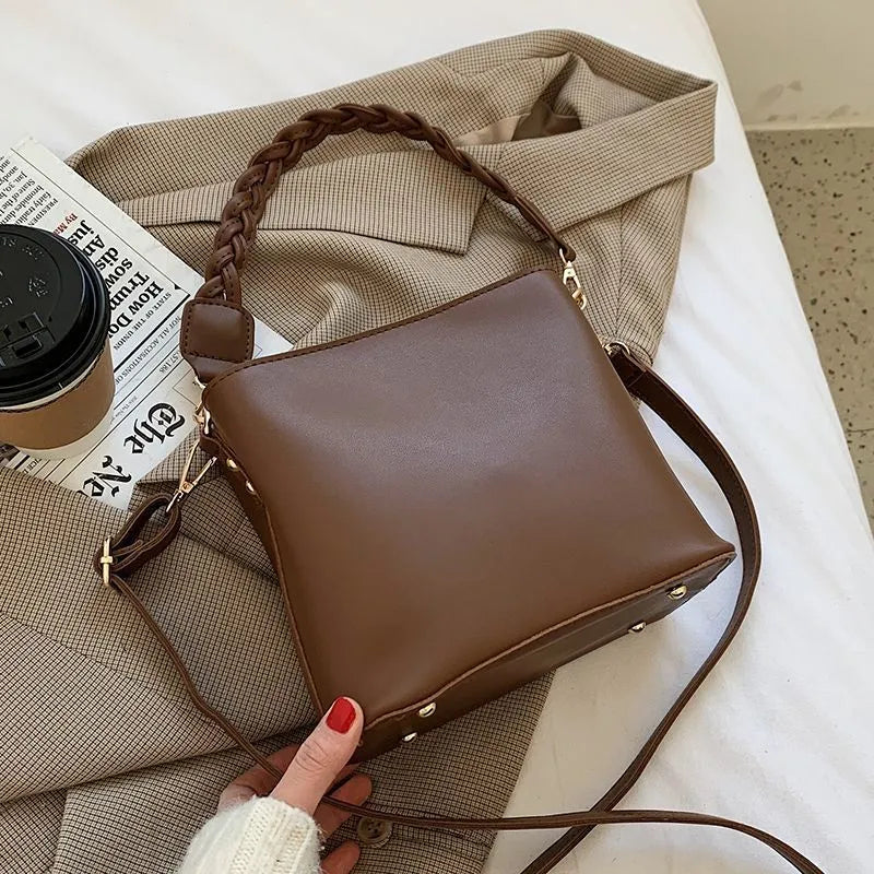 Khaki unisex PU crossbody bucket bag with woven texture and shoulder strap
