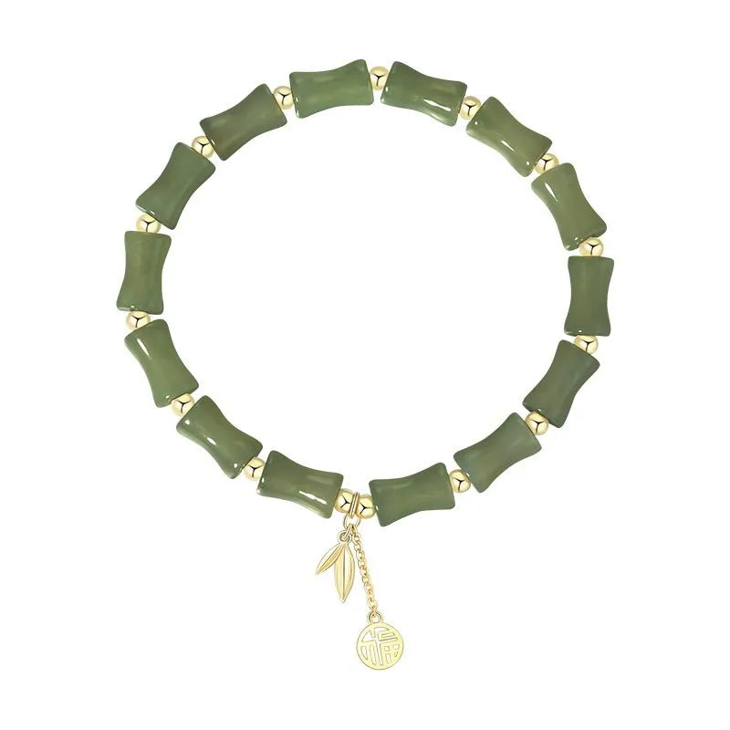 Green Chinese-style bamboo joint bracelet and necklace set made from alloy with Hetian jade accents.