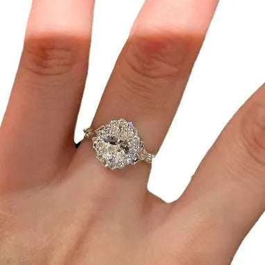 Silver geometric ellipse diamond ring with adjustable opening on a copper band.