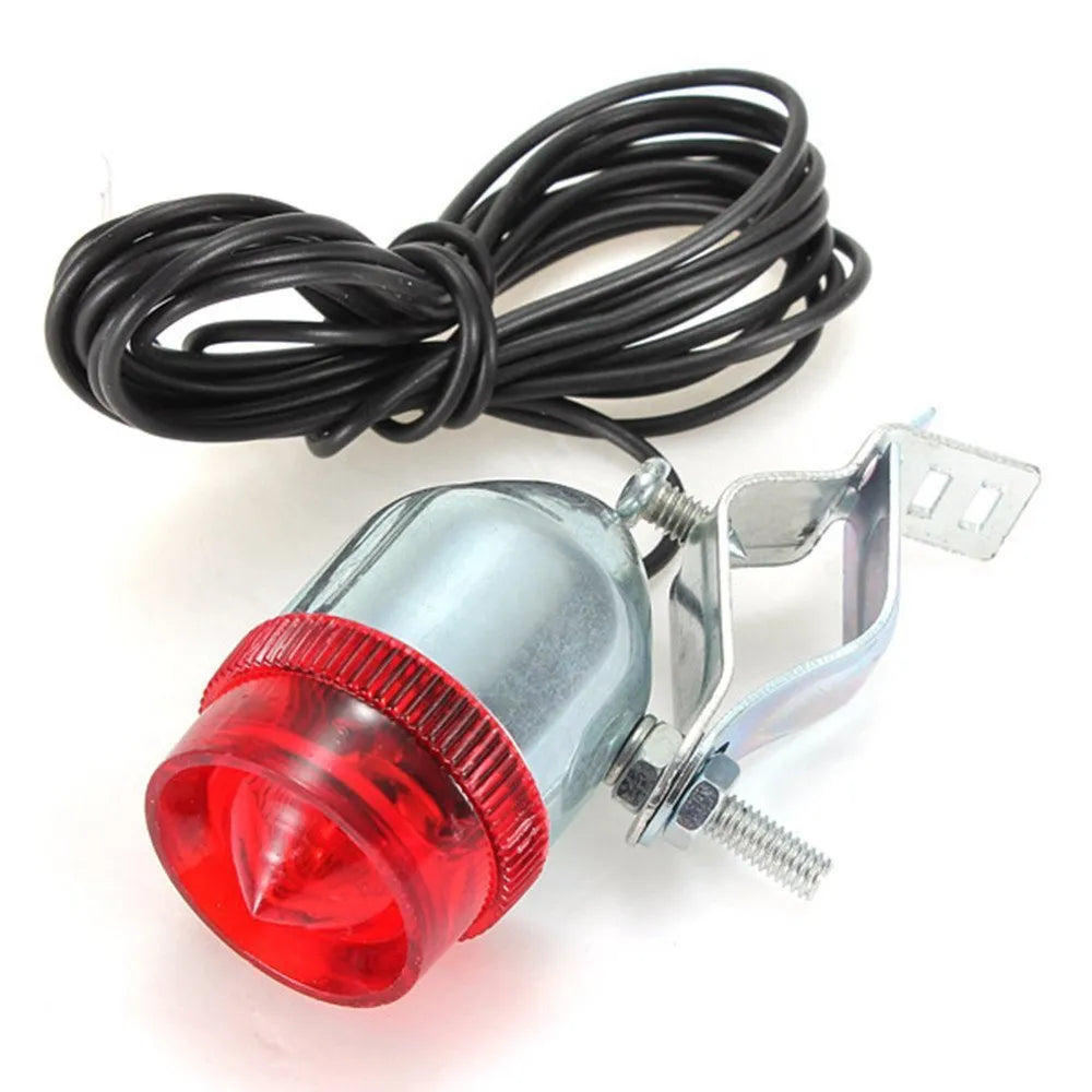 Silver bicycle dynamo-powered generator light kit mounted on a bicycle frame for front and rear lighting.