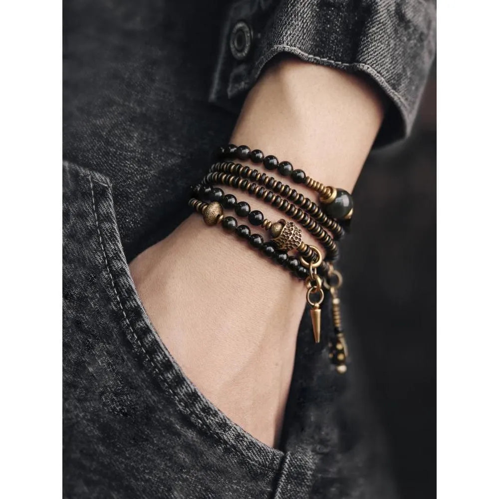 Black geometric beaded bracelet with multi-layered construction