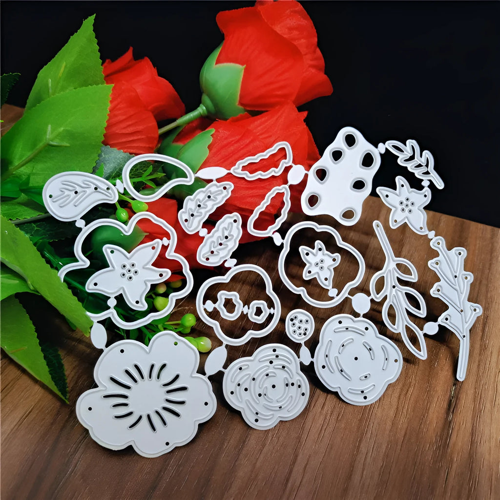Silver carbon steel flower knife mould for paper cutting measuring 14.3cm by 9.9cm with etched botanical design