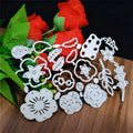 Silver carbon steel flower knife mould for paper cutting measuring 14.3cm by 9.9cm with etched botanical design