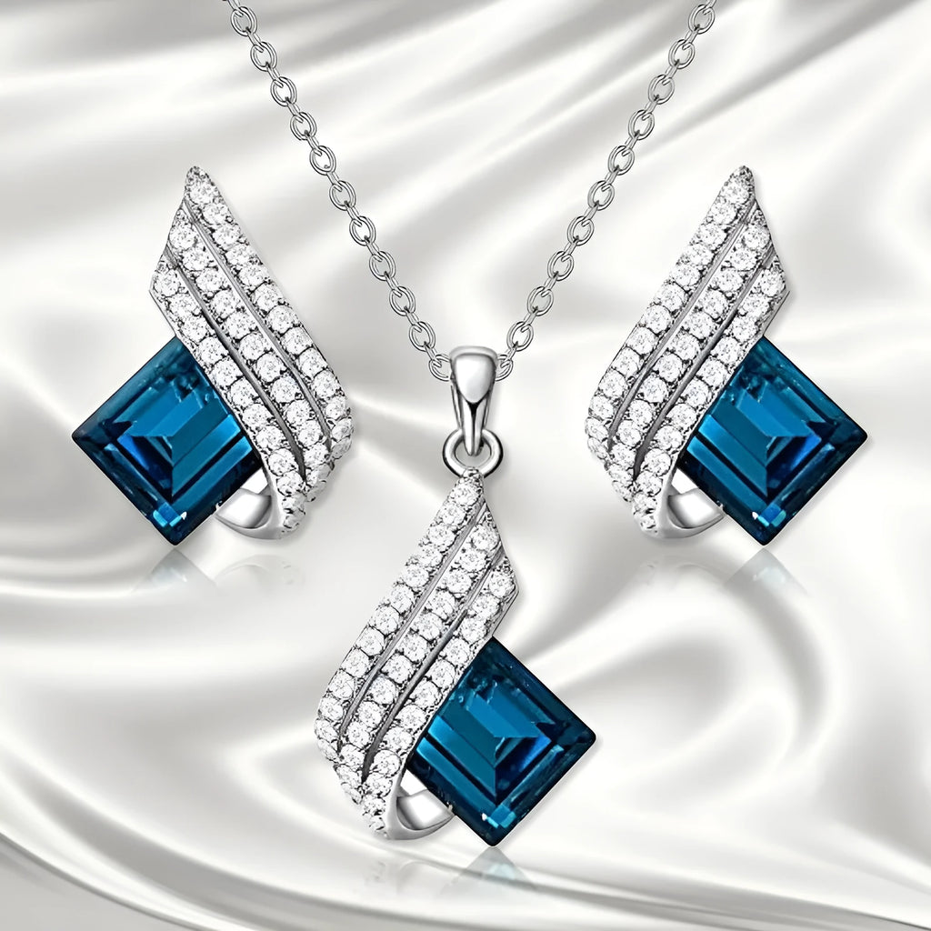 Women's electroplated necklace and earring set with alloy pendant and glass accents on cross chain