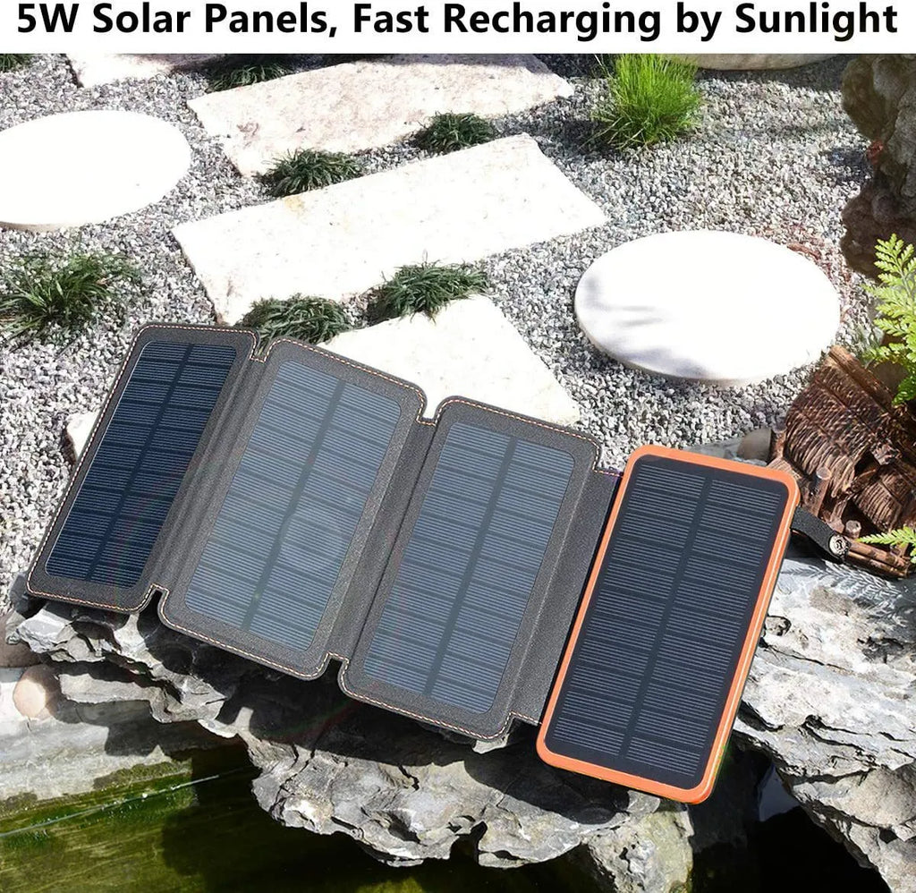 A black outdoor solar power bank with a solar panel, LED light, and soft leather finish, shown with a charging cable.