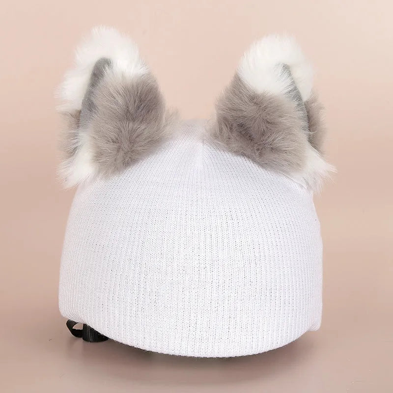 Plush cartoon-themed cover set on a medium motorcycle helmet with soft ear decorations.