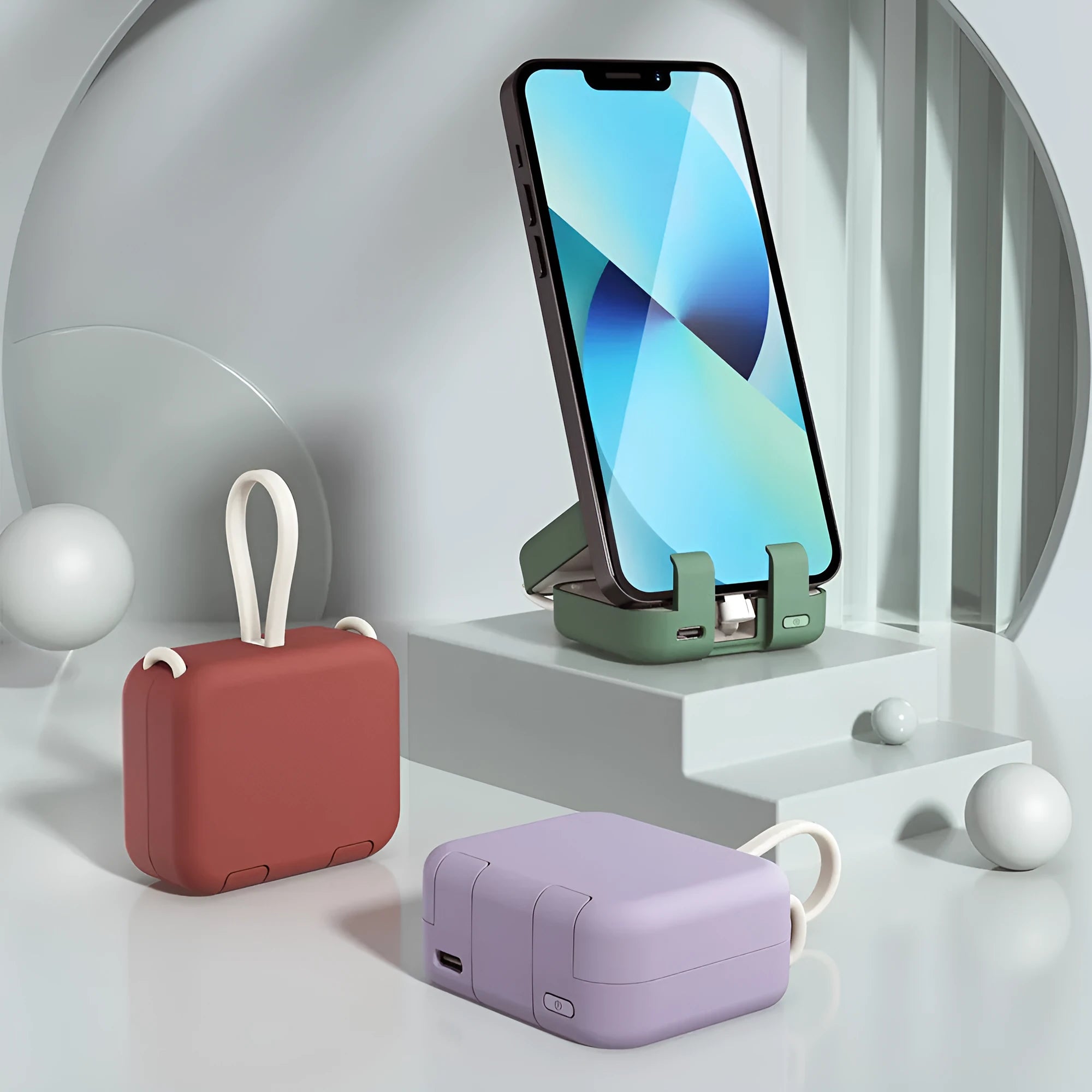 Red multi-function bracket mobile power supply showing USB-C and Lightning ports and integrated phone holder.
