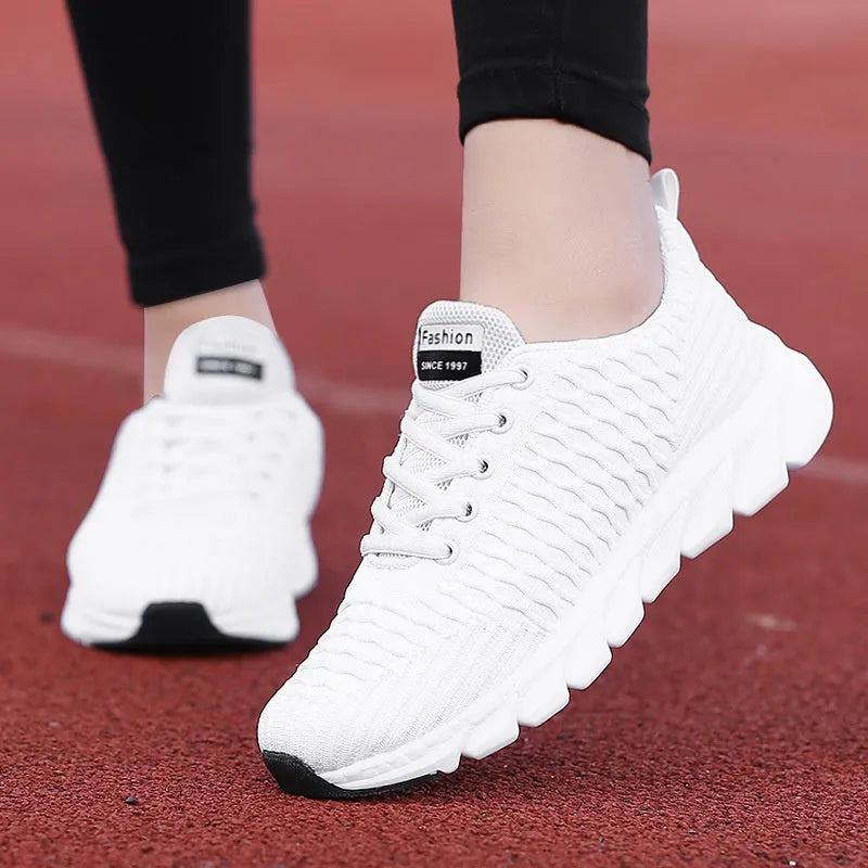 Women's running shoes showing fly weaving upper material and wear-resistant outsole in black, pink, or white colour options