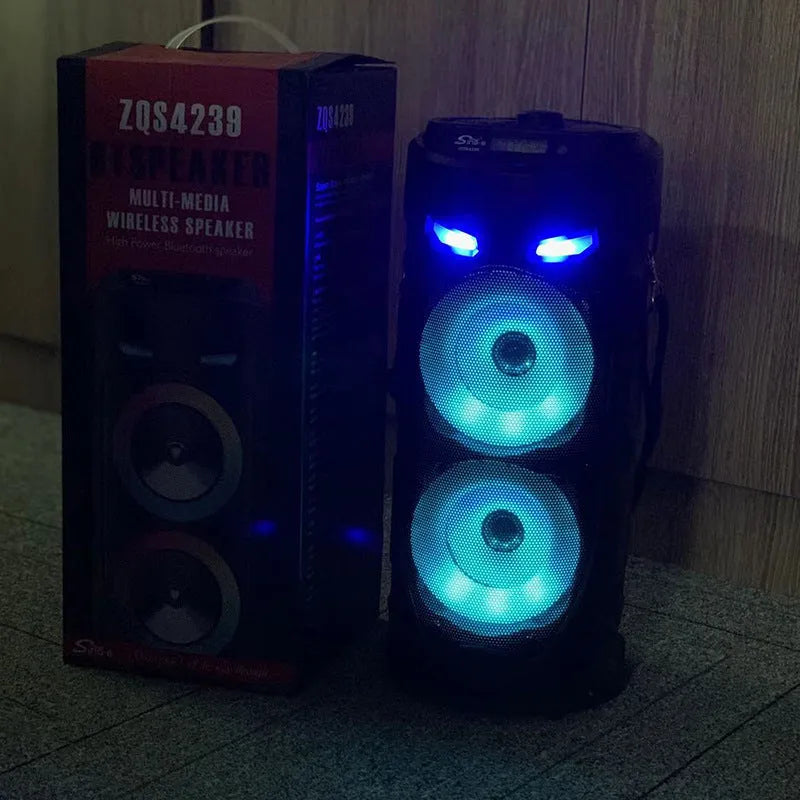 Black portable Bluetooth speaker with dual horn design and wheat aesthetic details