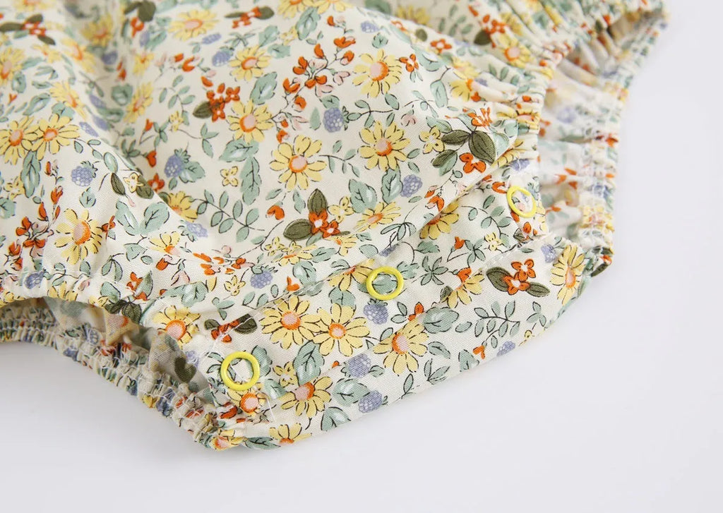 Yellow cotton floral baby romper with doll collar, triangle jumpsuit style for girls 0-6 months to 2-3 years