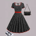 Women's multicolour polka dot pleated dress with a square collar and zip front.