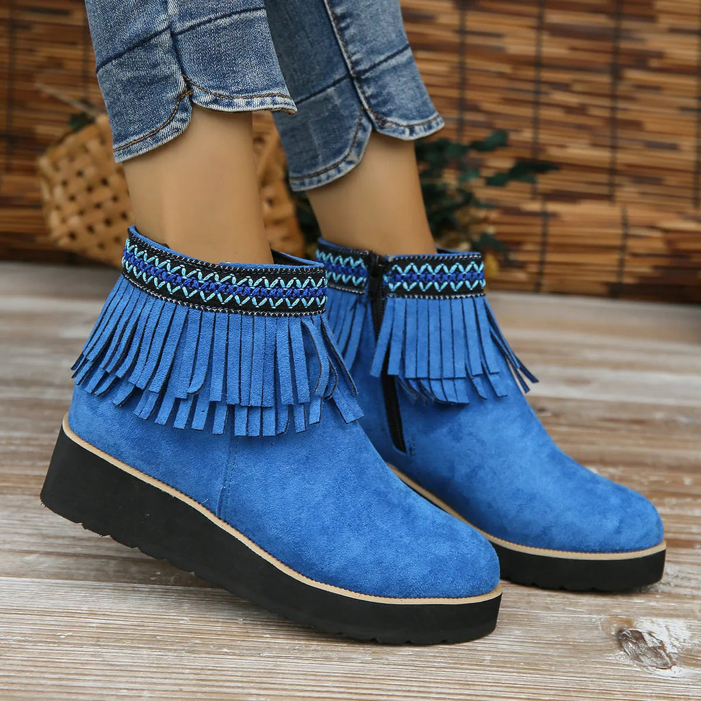 Women's dark brown suede wedge ankle boot with side zipper, tassel, and thick waterproof platform sole.