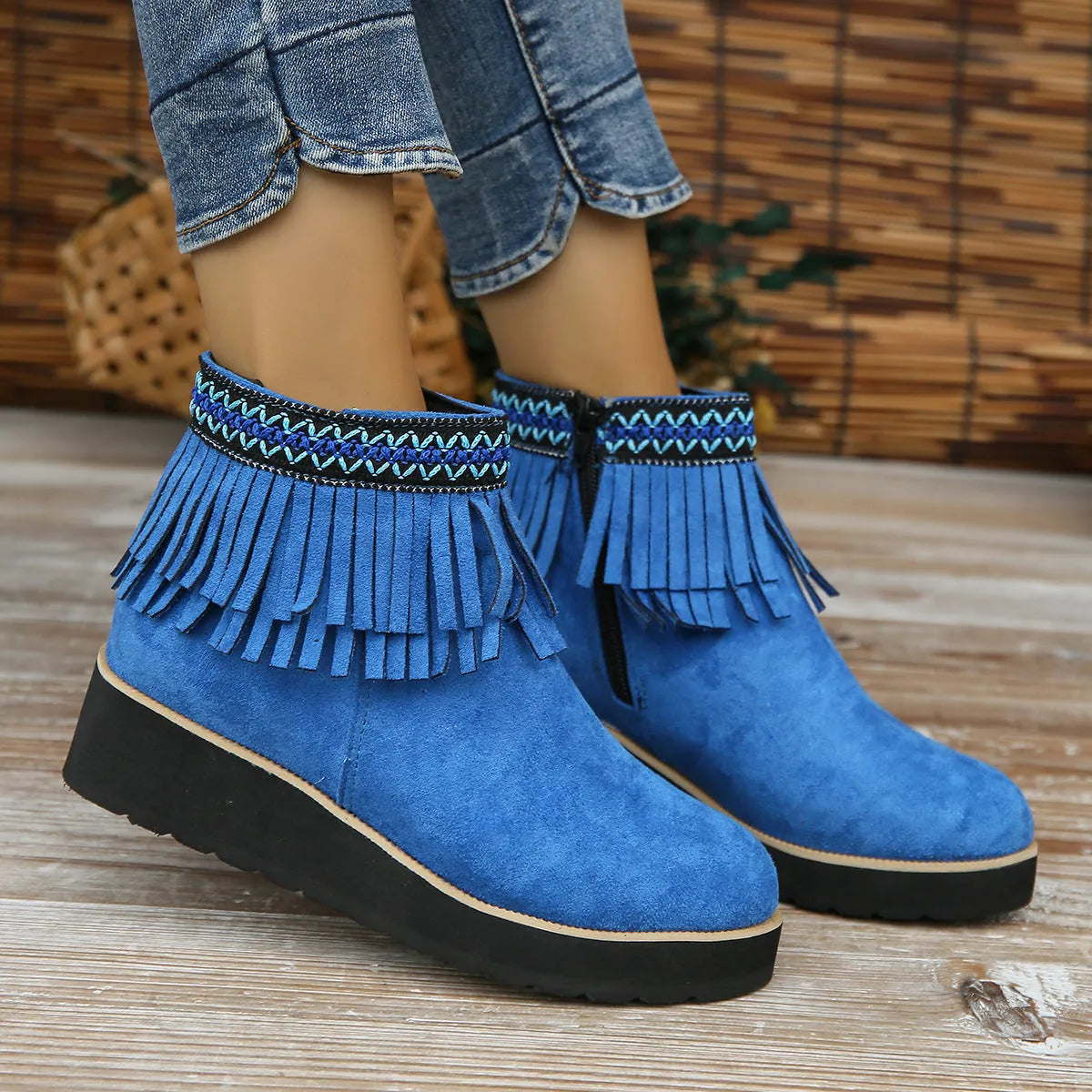 Women's dark brown suede wedge ankle boot with side zipper, tassel, and thick waterproof platform sole.