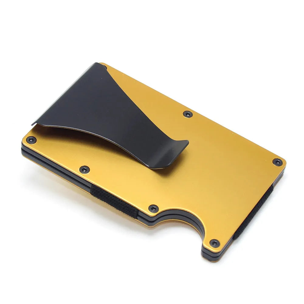 Geometric carbon fibre and aluminium business card holder, 8mm thick, on a table.