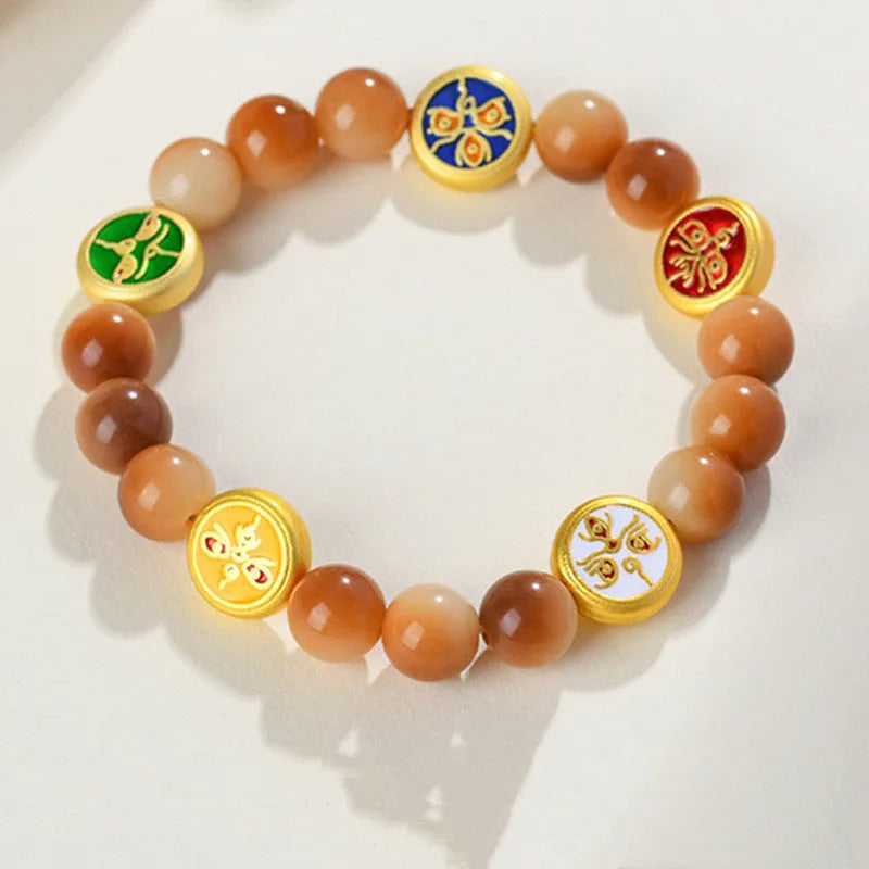 Yellow Bodhi seed bracelet showing five directions geometric design with round beads