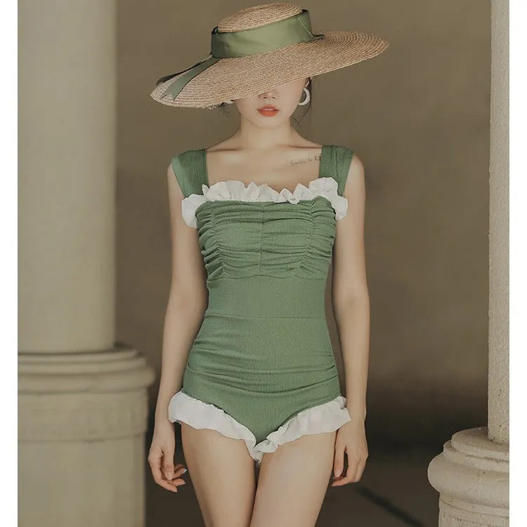 Women's high-waisted one-piece swimsuit in quick-dry polyester, shown in black, green, and pink.