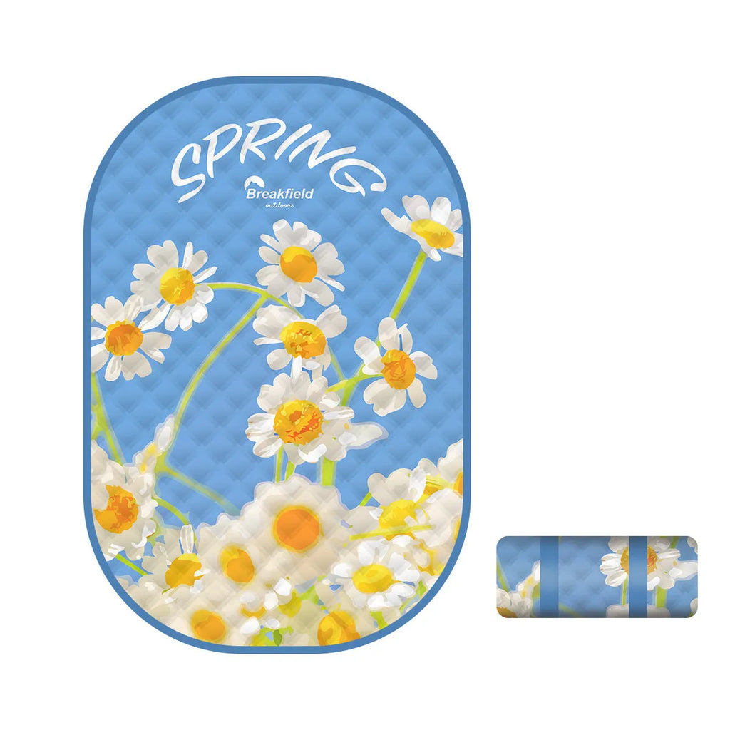 Waterproof ultrasonic thickening outdoor picnic mat in a seasonal colour, laid flat on grass.