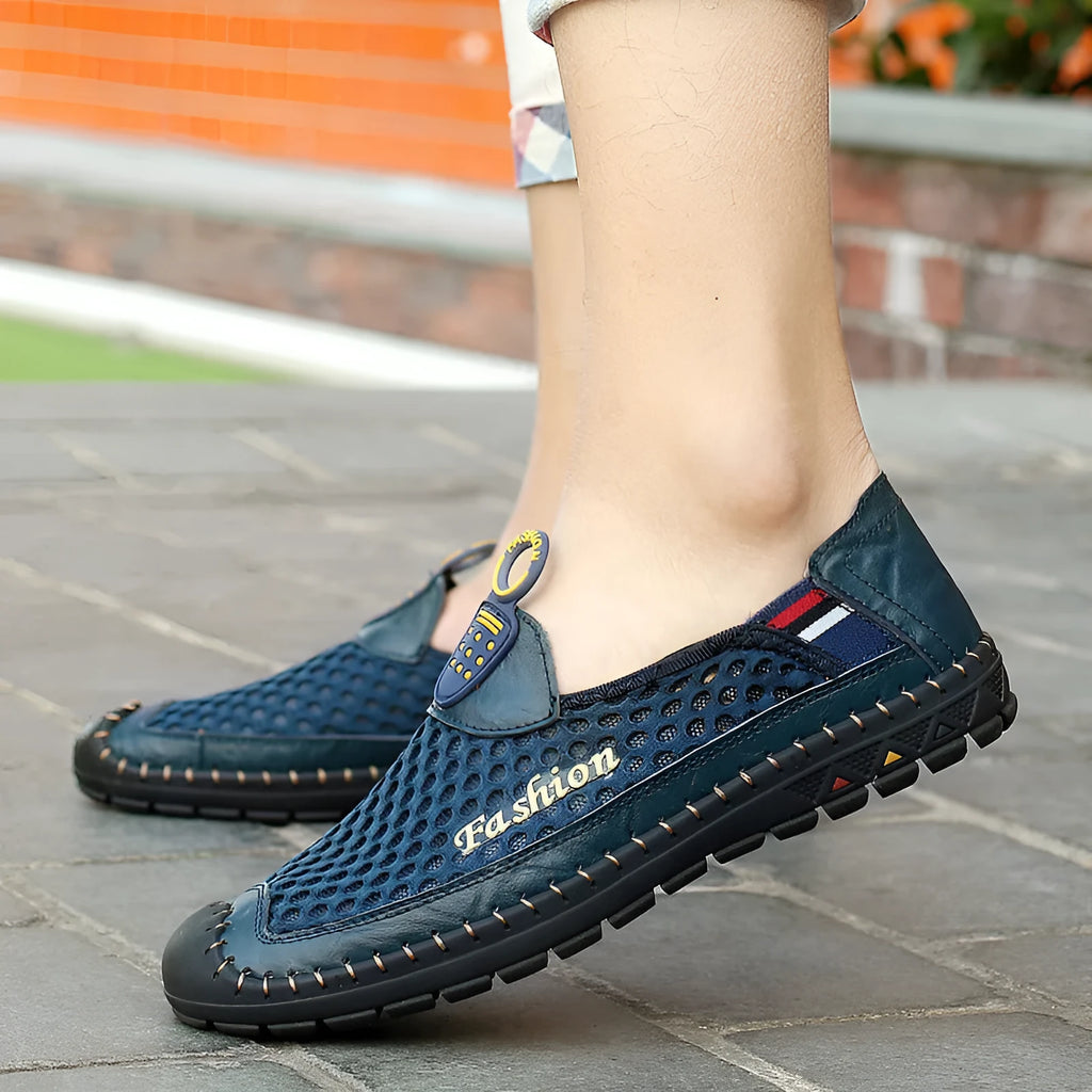 Men's brown casual shoes with mesh upper and rubber sole on a light background.