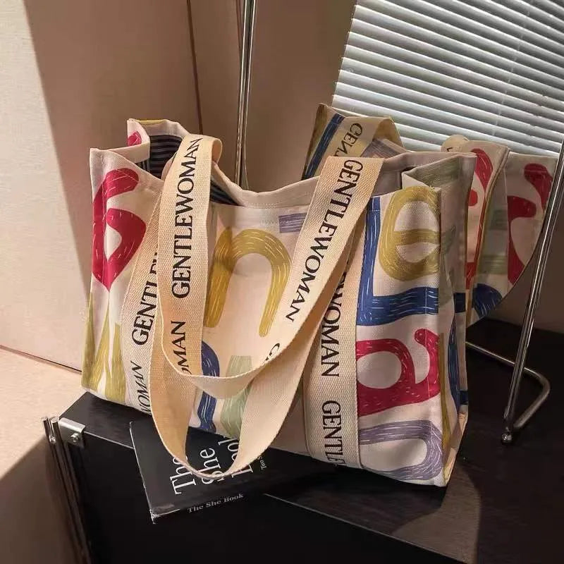 Canvas women's tote bag with printed pattern and shoulder strap design