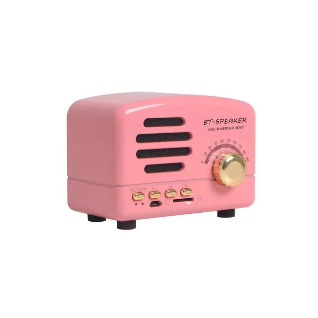 Compact Bluetooth speaker with wood grain finish, showing front grill and control buttons.