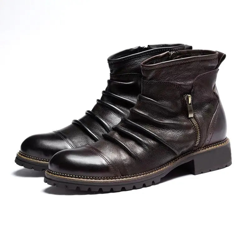 Mid-calf black cowboy boot with side zipper, embossed pattern, round toe, and a mid-height heel.
