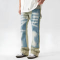 Yellow and blue retro patchwork splash-ink distressed design jeans on a mid-waist.