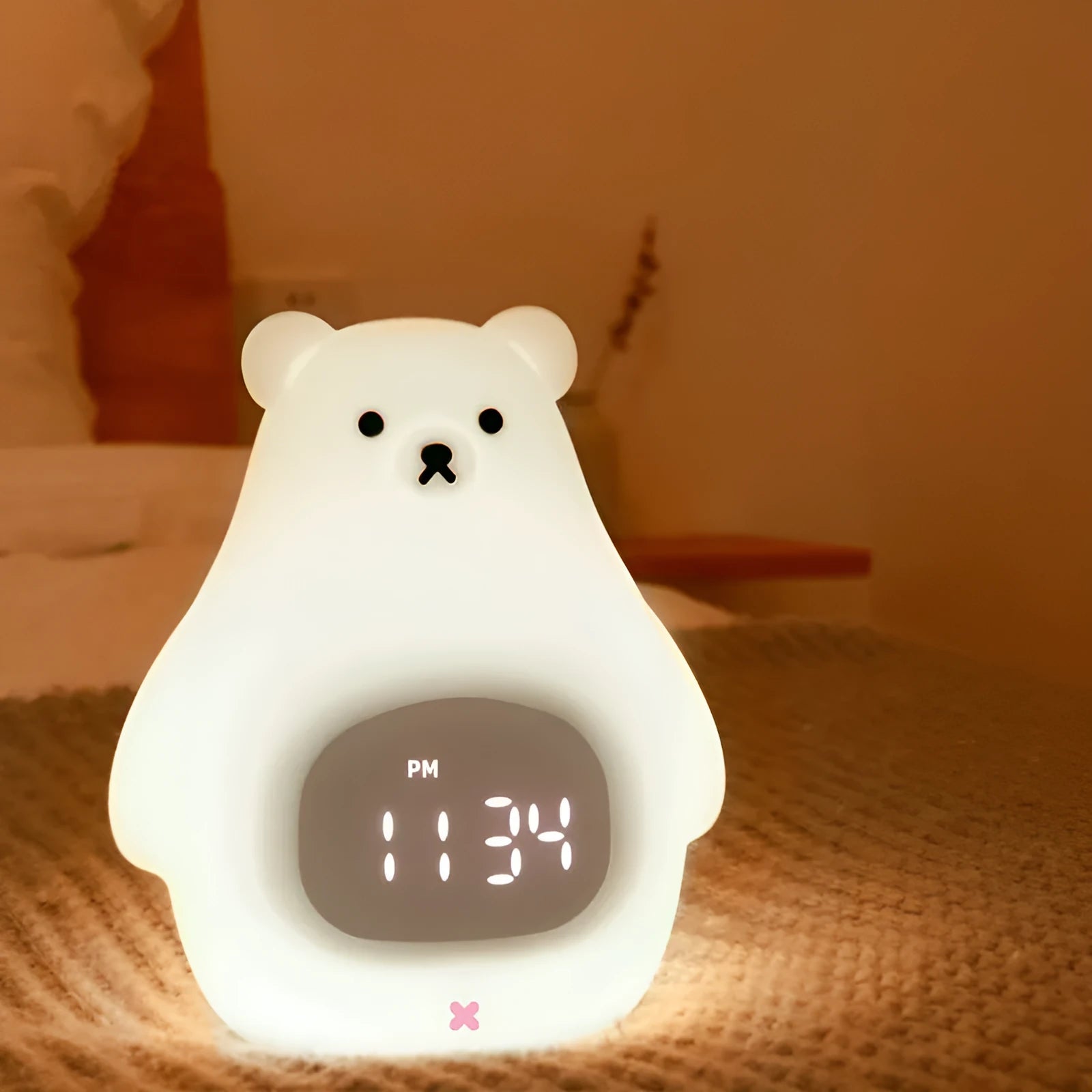 Big White Bear shaped silicone night light with colourful light display on a table