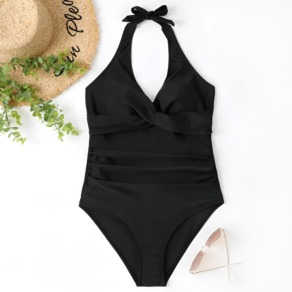 Women's solid colour cross-front one-piece swimsuit in bikini style on a hanger