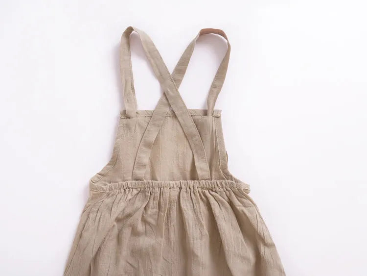Children's khaki cotton overalls shorts with bow detail and straps, front view