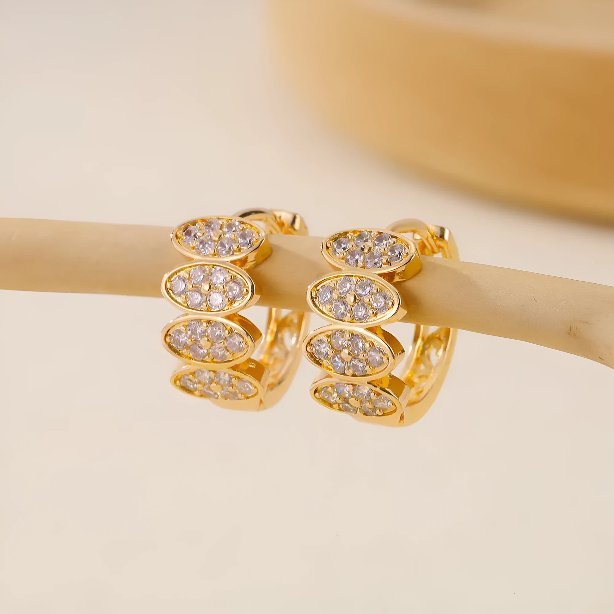 A pair of women's copper earrings with an inlaid zircon stone, designed in an ins style.