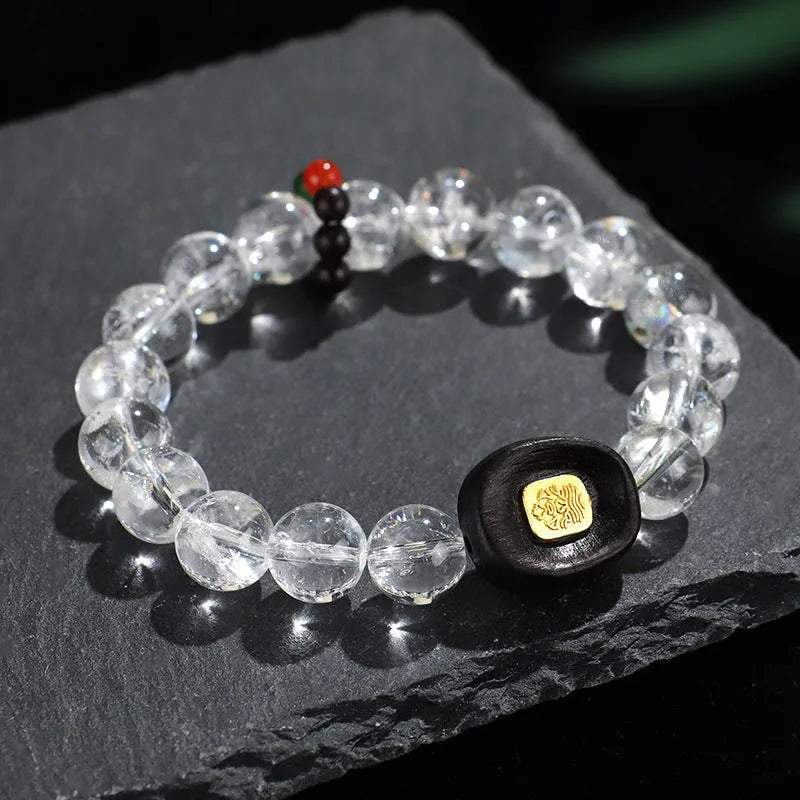Handmade natural white crystal ebony bracelet with five warp design on wooden background