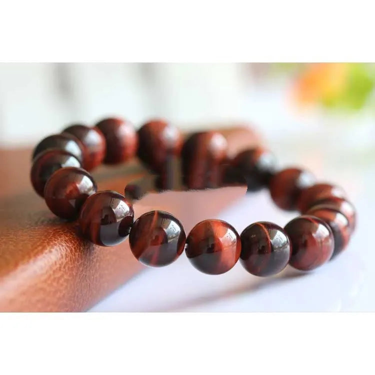 Handmade tiger's eye gemstone bracelet with lightning cat's eye pattern in geometric round beads