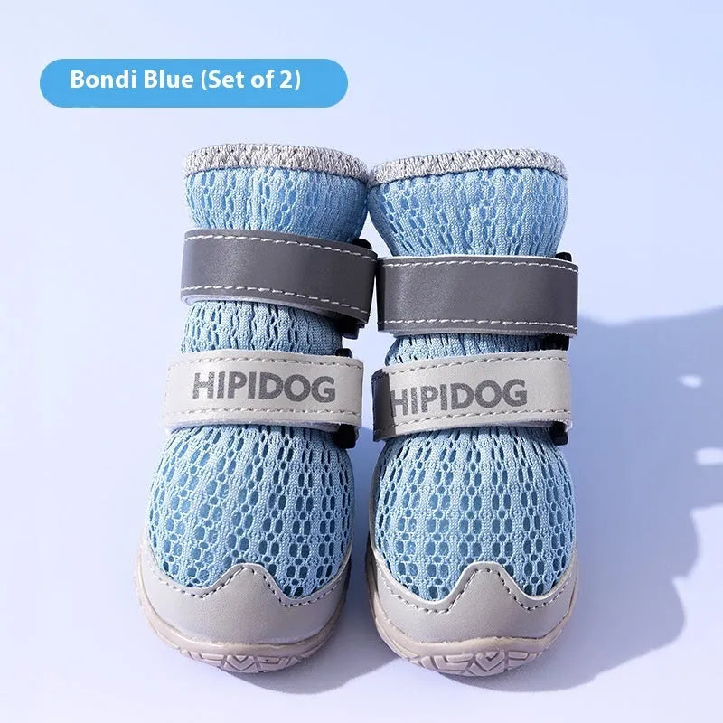 Cartoon style blue and green dog shoes made from PU material for summer paw protection.