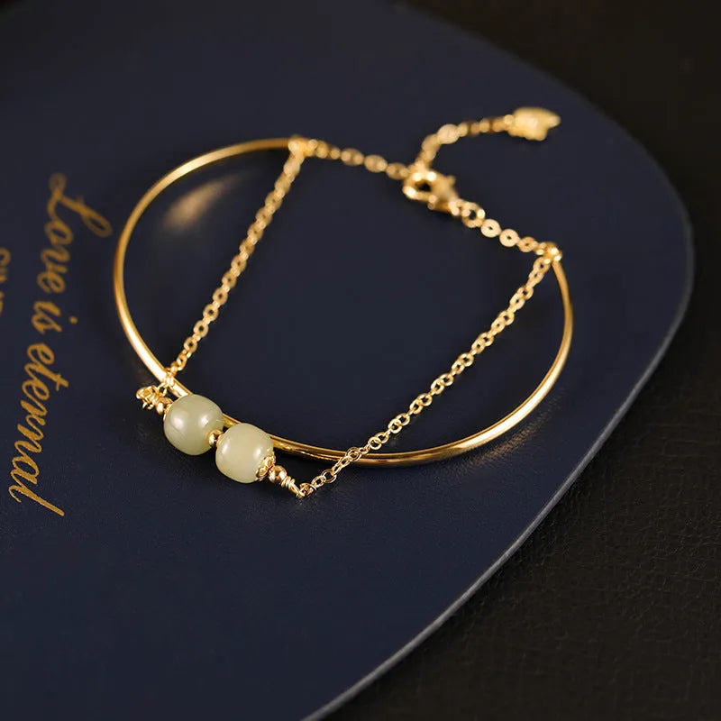 Women's Hetian jade lucky beads bracelet with gold inlay, shown in single, double, and three bead versions.