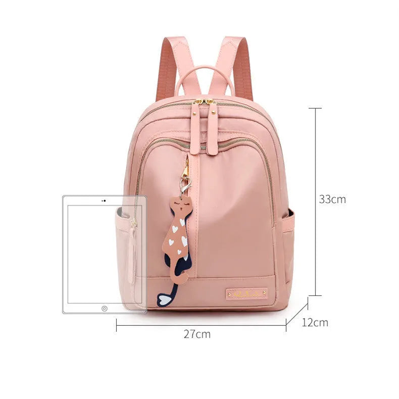 Black and pink views of a women's casual nylon backpack with double straps, a soft handle, and an external pocket.