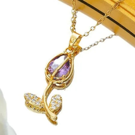 Zircon tulip flower pendant necklace for women in gold colour on an adjustable O-ring chain.