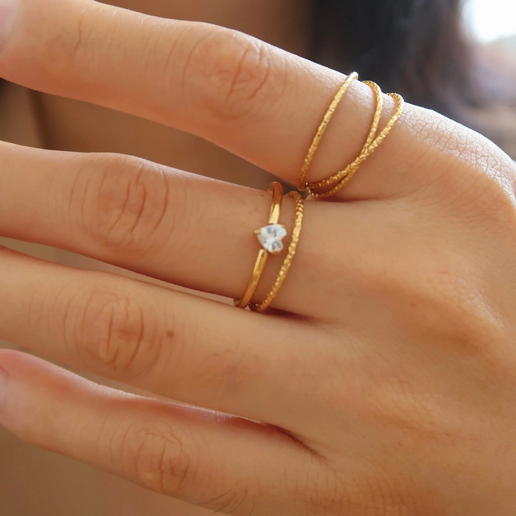 Golden electroplated stainless steel ring showing love heart and oval shapes in sizes no.5 to no.8