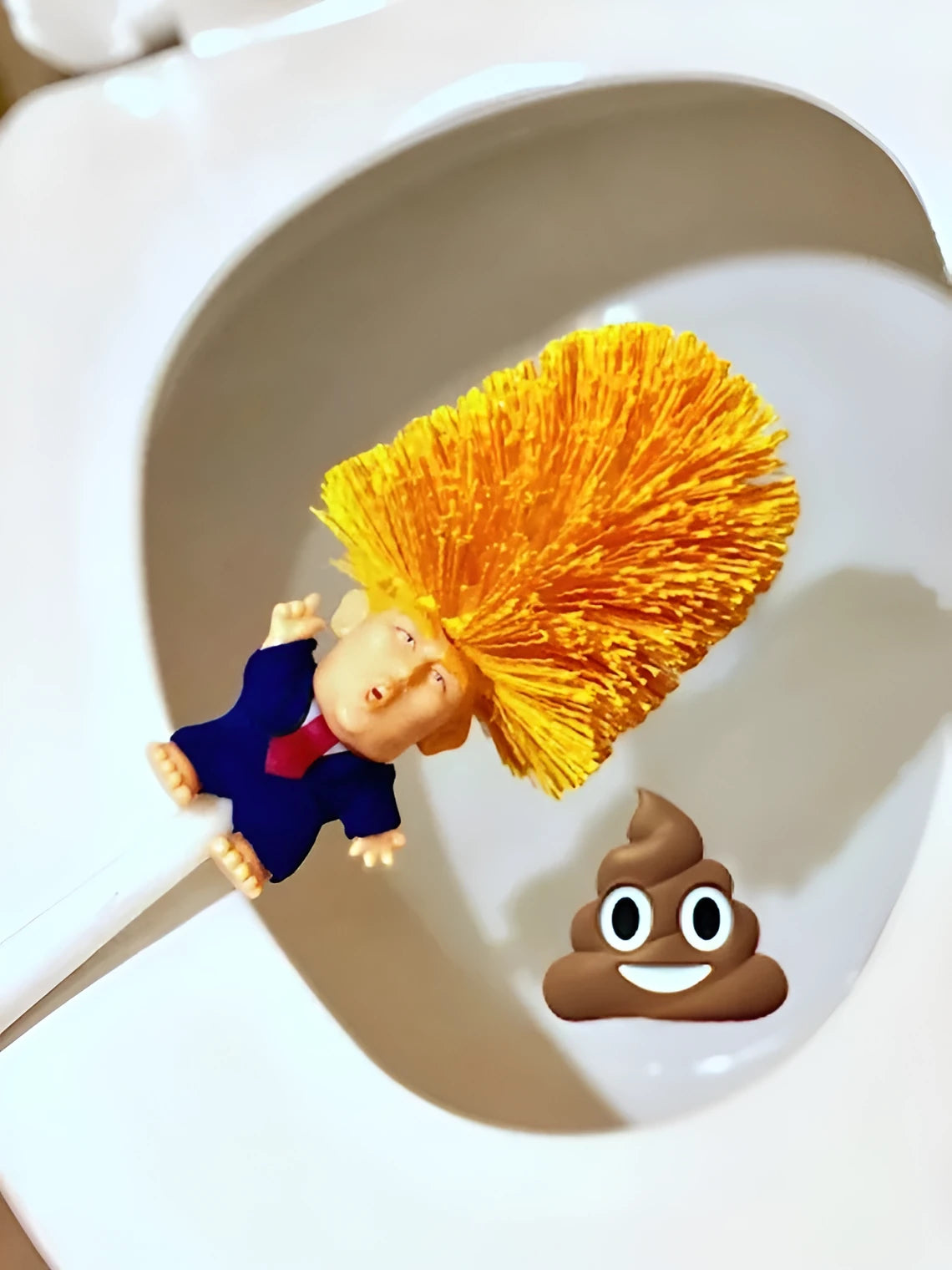 Yellow plastic Donald Trump novelty toilet brush with hanging handle, 40cm long