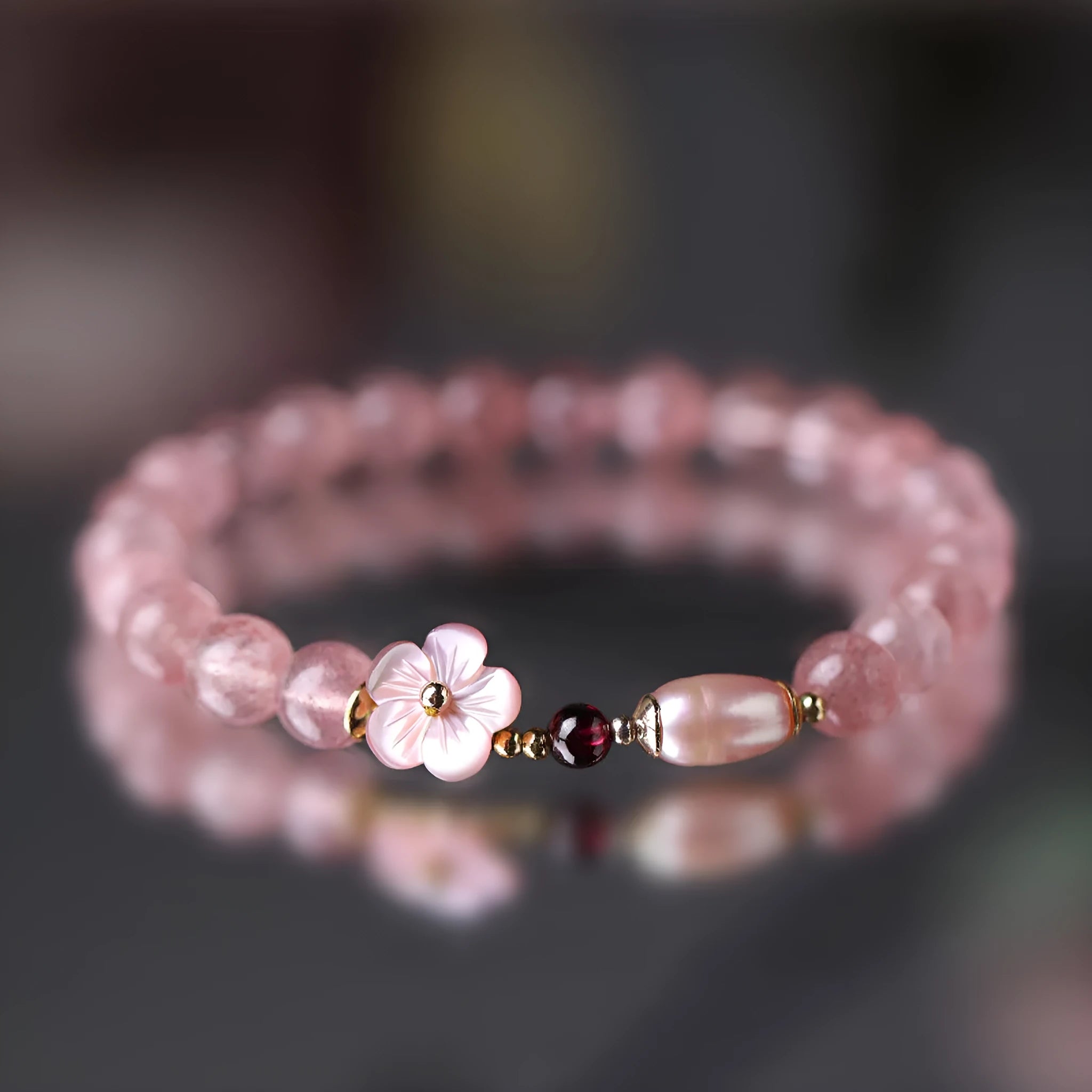 Strawberry quartz crystal bracelet with floral peach blossom design and silver-tone metal fittings
