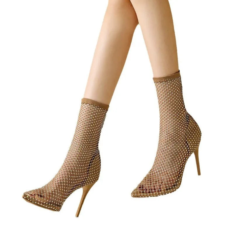Gold mesh pointed stiletto high heel sandals on a white background