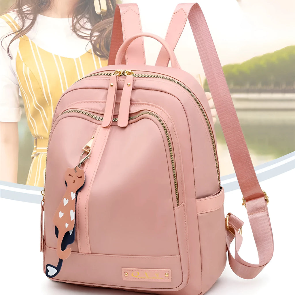 Black and pink views of a women's casual nylon backpack with double straps, a soft handle, and an external pocket.