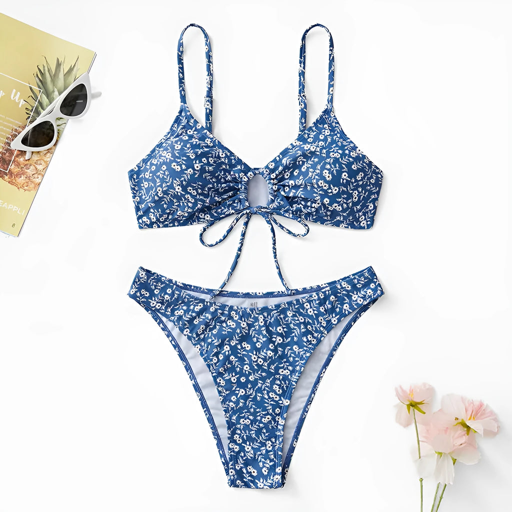 Blue women's swimsuit three-piece set with a top and shorts on a mannequin.