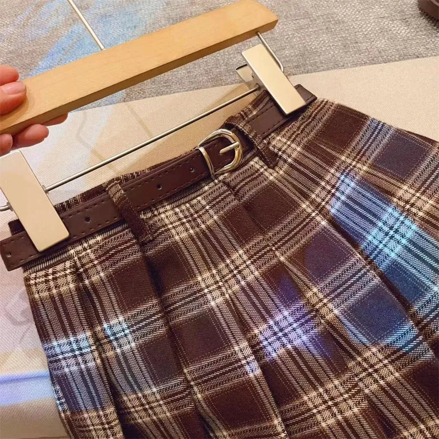 Girls plaid pleated A-line skirt in cotton blend fabric on a hanger