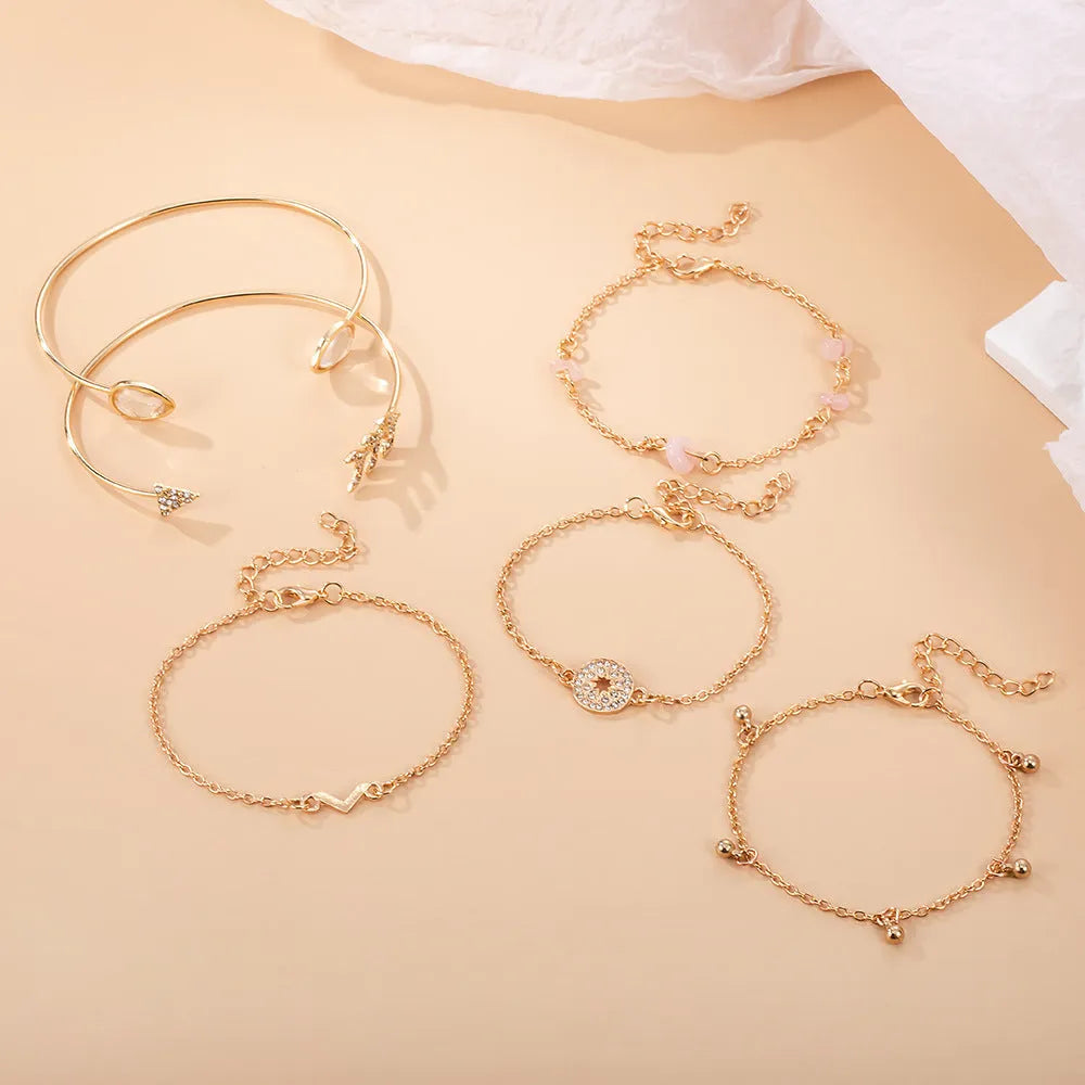 Gold-coloured zinc alloy women's bracelet set with six European-inspired designs including water drop and arrow shapes