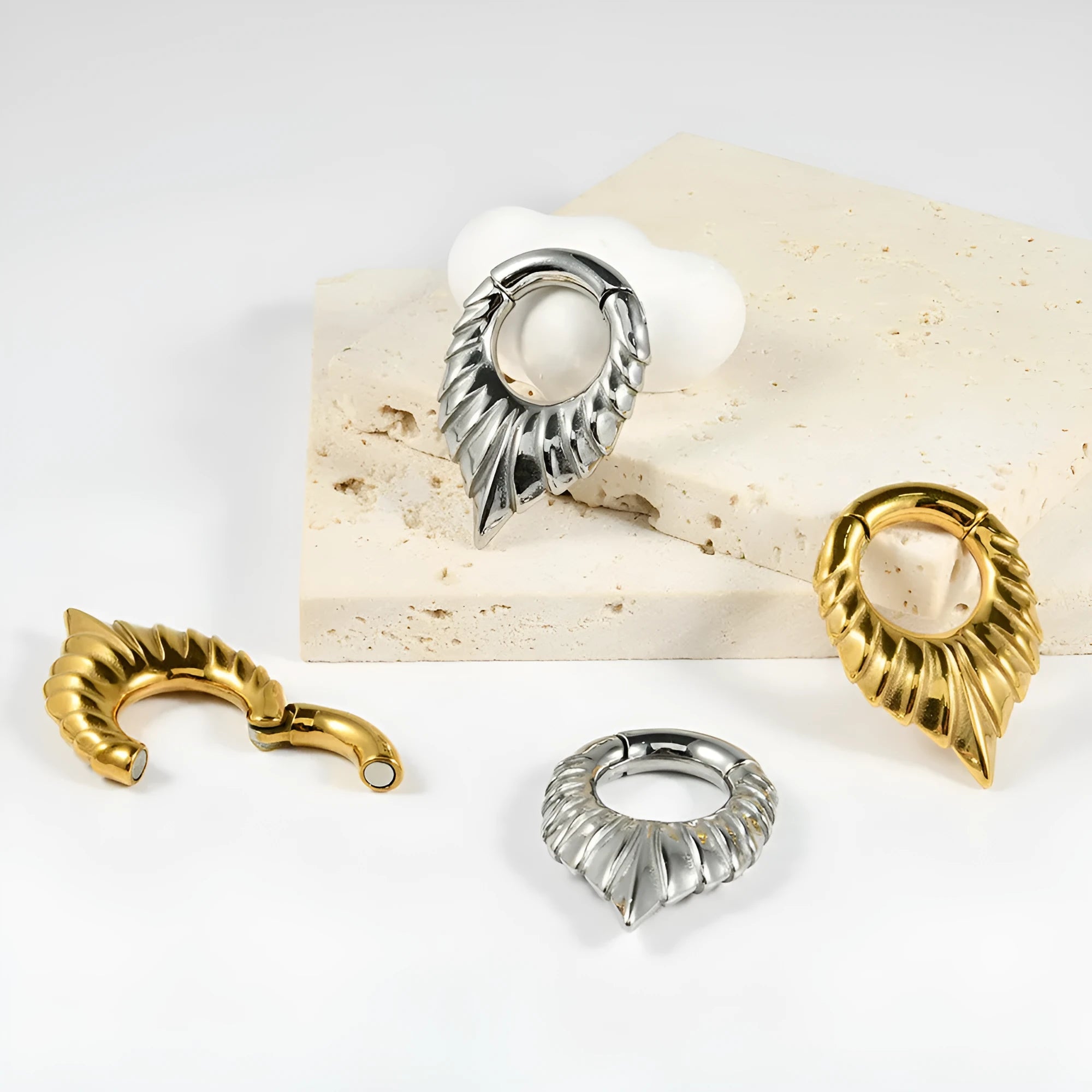 Stainless steel drop-shaped auricle ear extender with round hanging egg design.