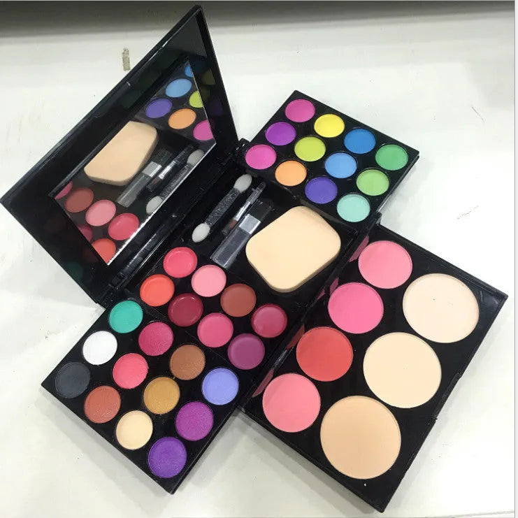 Three-layer makeup box with 24 colour eyeshadows, 8 lipsticks, blushes, powders, brushes, and mirror